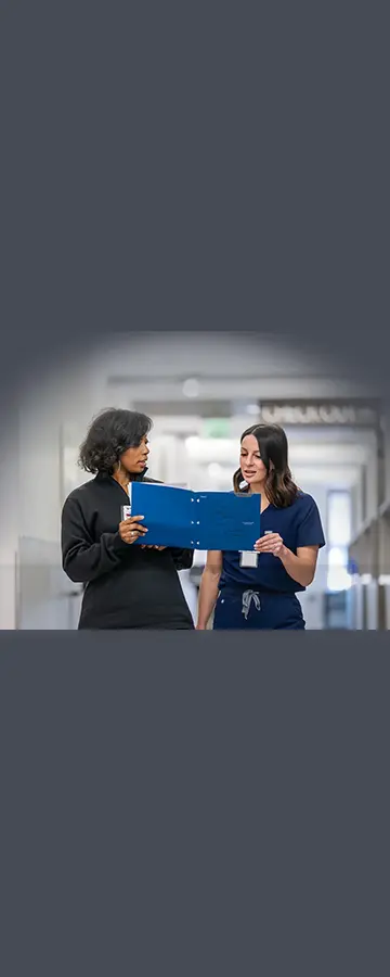 Two nurses reviewing records