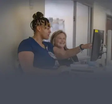 Two nurses reviewing information together
