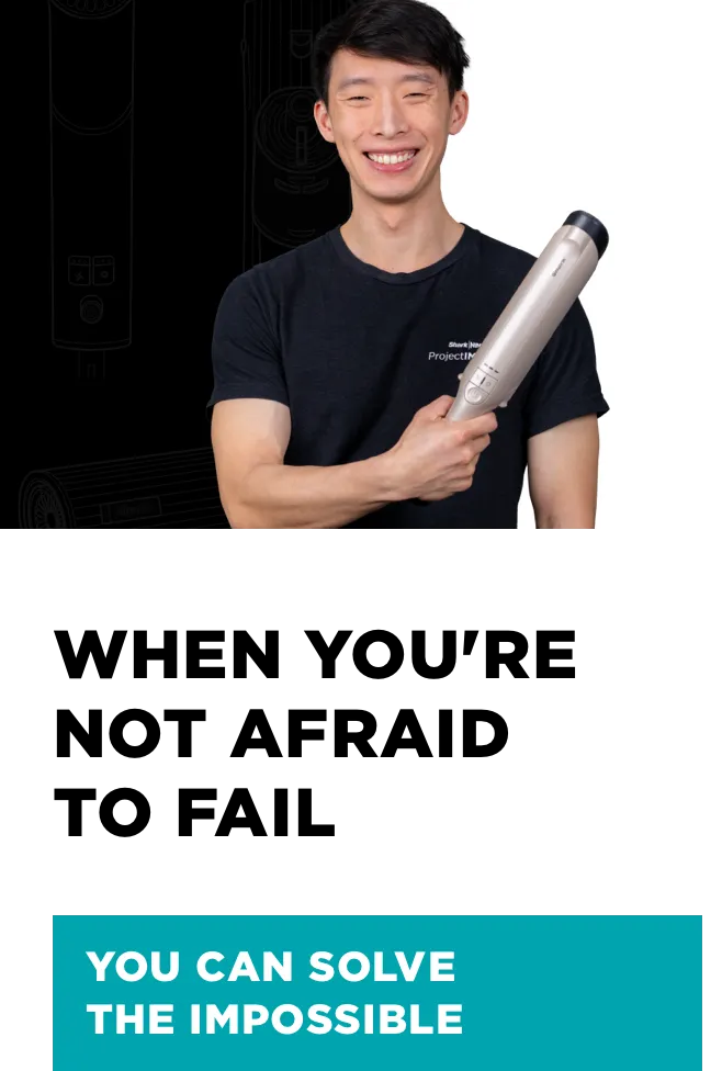 A Man holding a vacuum