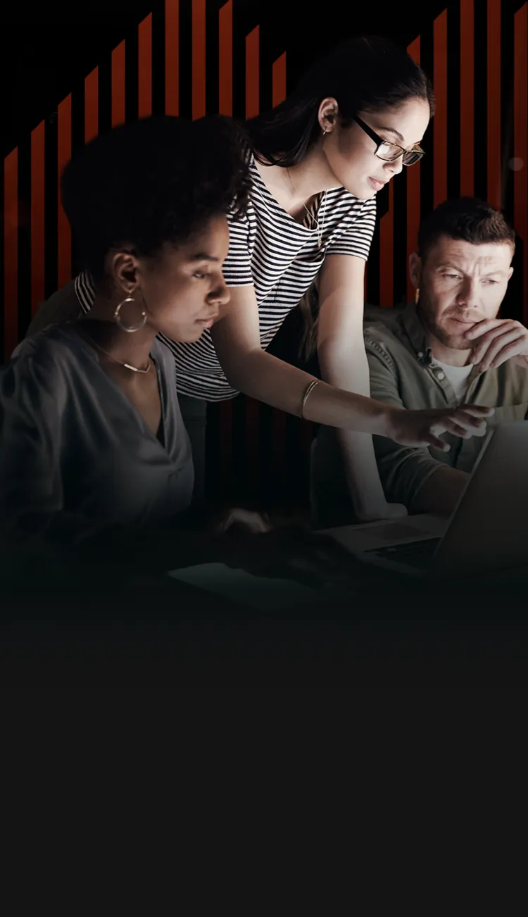 A group of employees troubleshooting on a computer