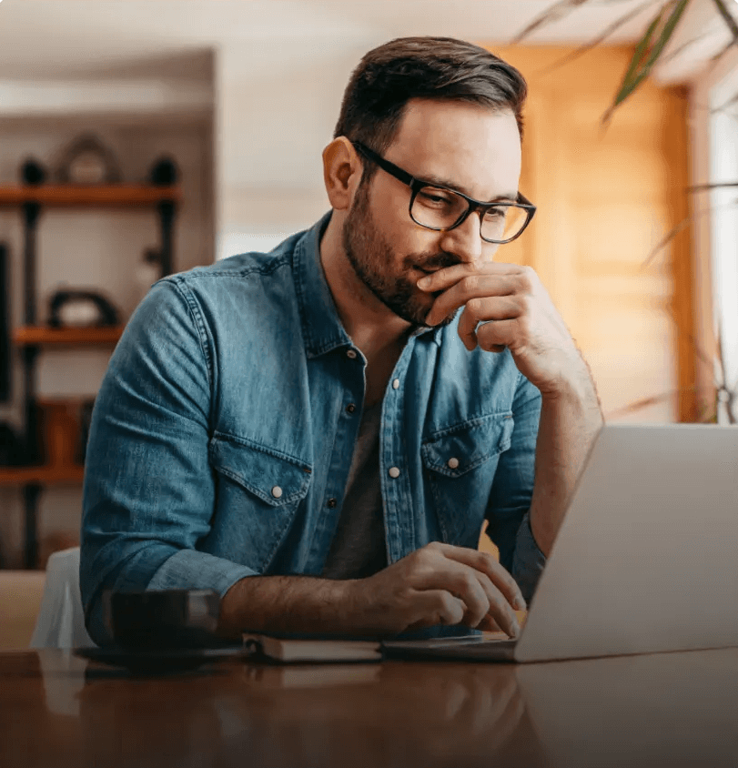 Man working on a laptop in a cafe