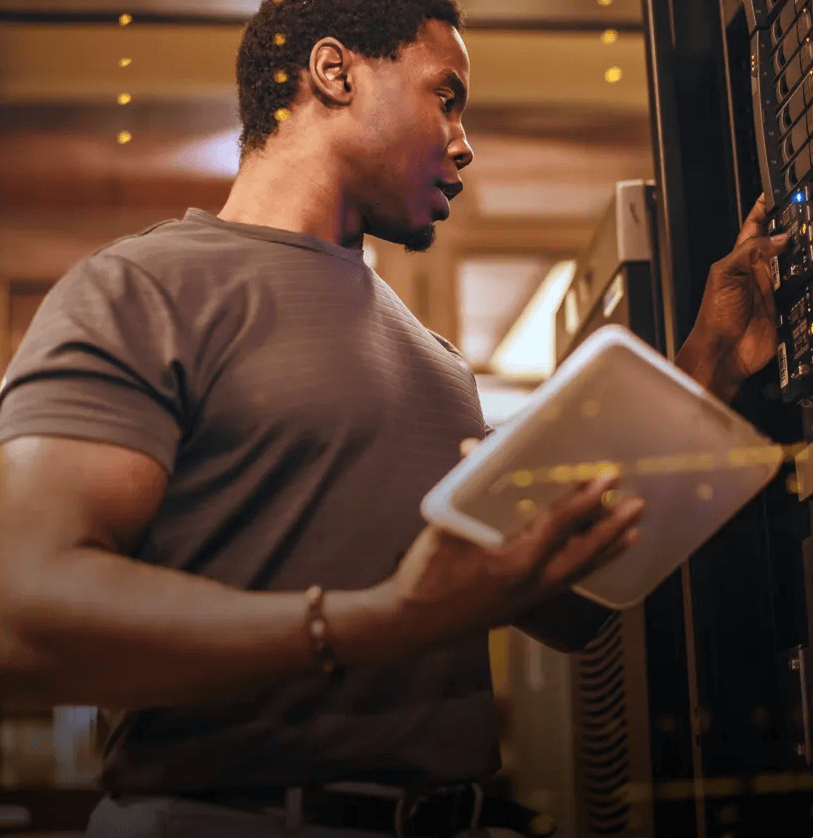 A man working in a server room