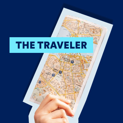 Hand holding a city map against a dark blue background.