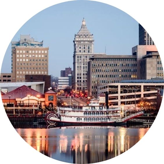 Peoria, Illinois riverfront with a paddlewheel boat and downtown skyline.