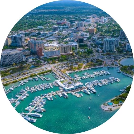Aerial view of Sarasota, Florida, featuring a marina and downtown skyline.