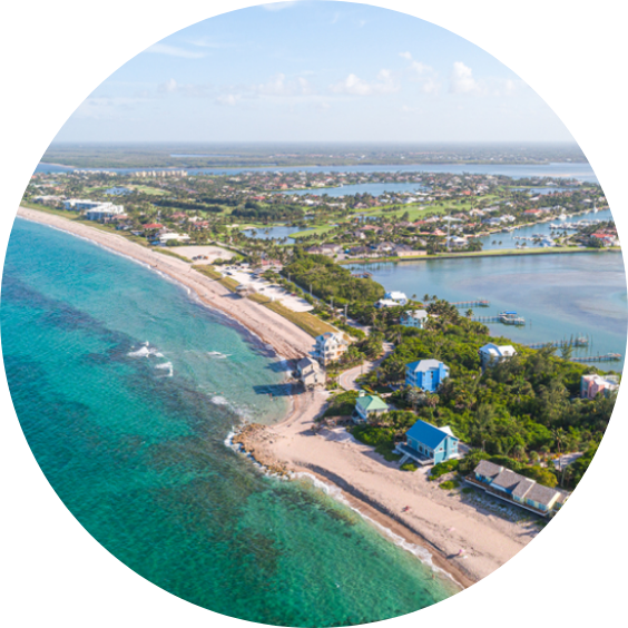 Aerial view of Stuart, Florida’s coastline with turquoise water, beaches, and waterfront homes.