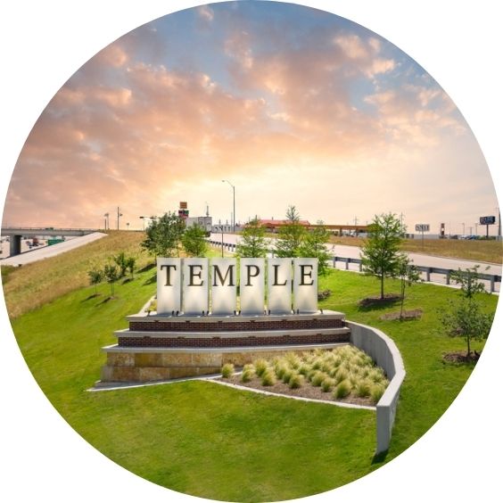 Temple, Texas welcome sign at sunset near the highway.