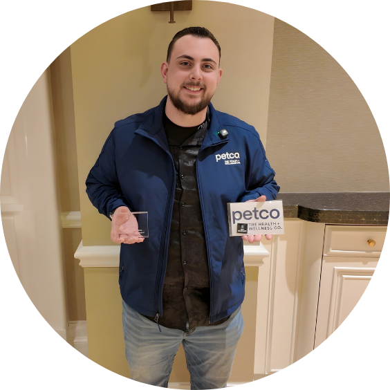 Petco RVT graduate smiling with awards