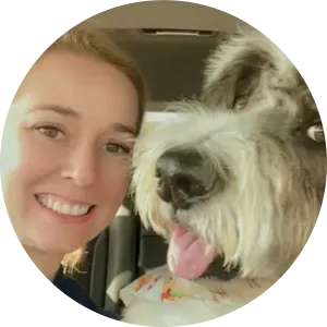 Woman smiling with a dog