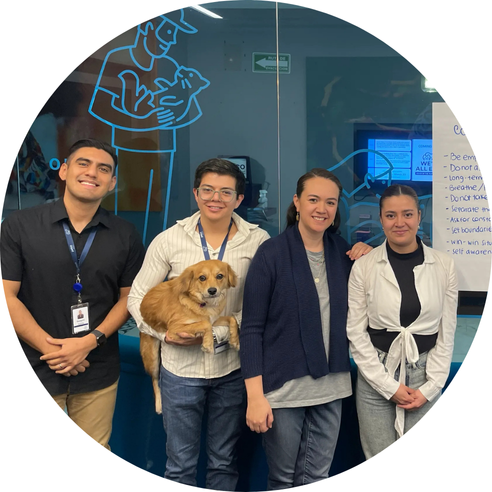 Group with dog near donation message
