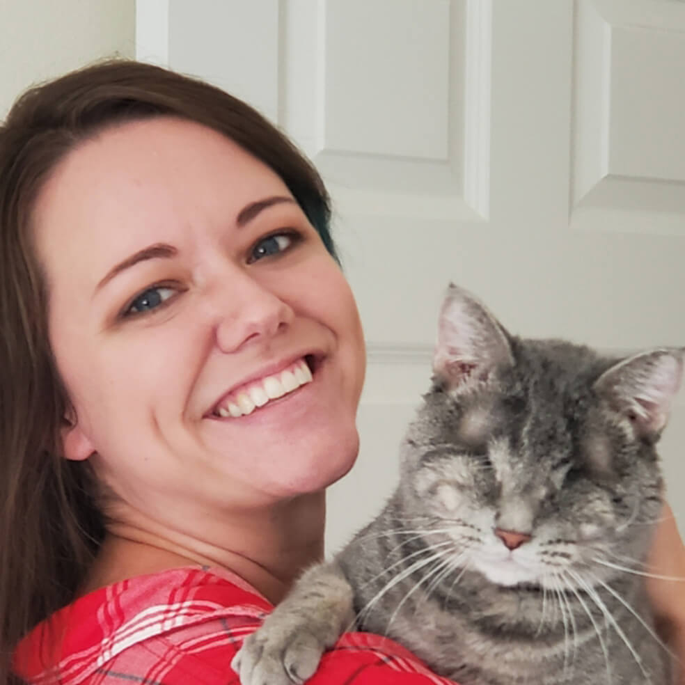 woman holding a cat