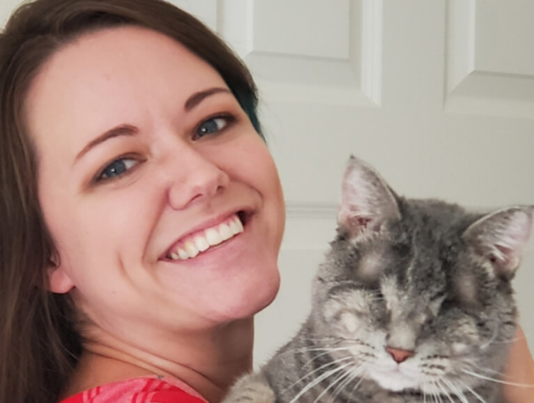 woman holding a cat