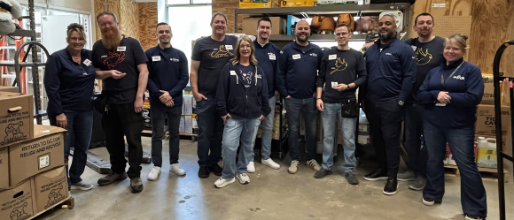Group of Petco employees in a storage room