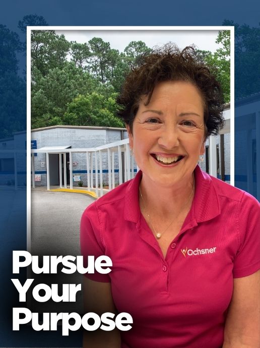 A woman wearing a pink polo shirt stands in front of a healthcare building. Text reads, "Pursue Your Purpose.”