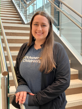 Female occupational therapist standing on a staircase