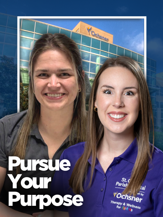 Two women, one in a gray shirt and one in a purple shirt, in front of a hospital