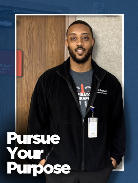 Smiling man wearing a gray t-shirt with a respiratory therapy graphic and a black jacket embroidered with 'Ochsner,' stands against a textured wall and wooden door. The text 'Pursue Your Purpose' overlays the bottom left corner.
