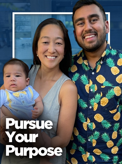 A man and woman stand together in front of a building, with the woman holding an infant. The adults wear casual clothing, including a patterned shirt and a sleeveless top. Text reads, "Pursue Your Purpose.”