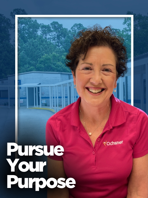 A woman wearing a pink polo shirt stands in front of a healthcare building. Text reads, "Pursue Your Purpose.”