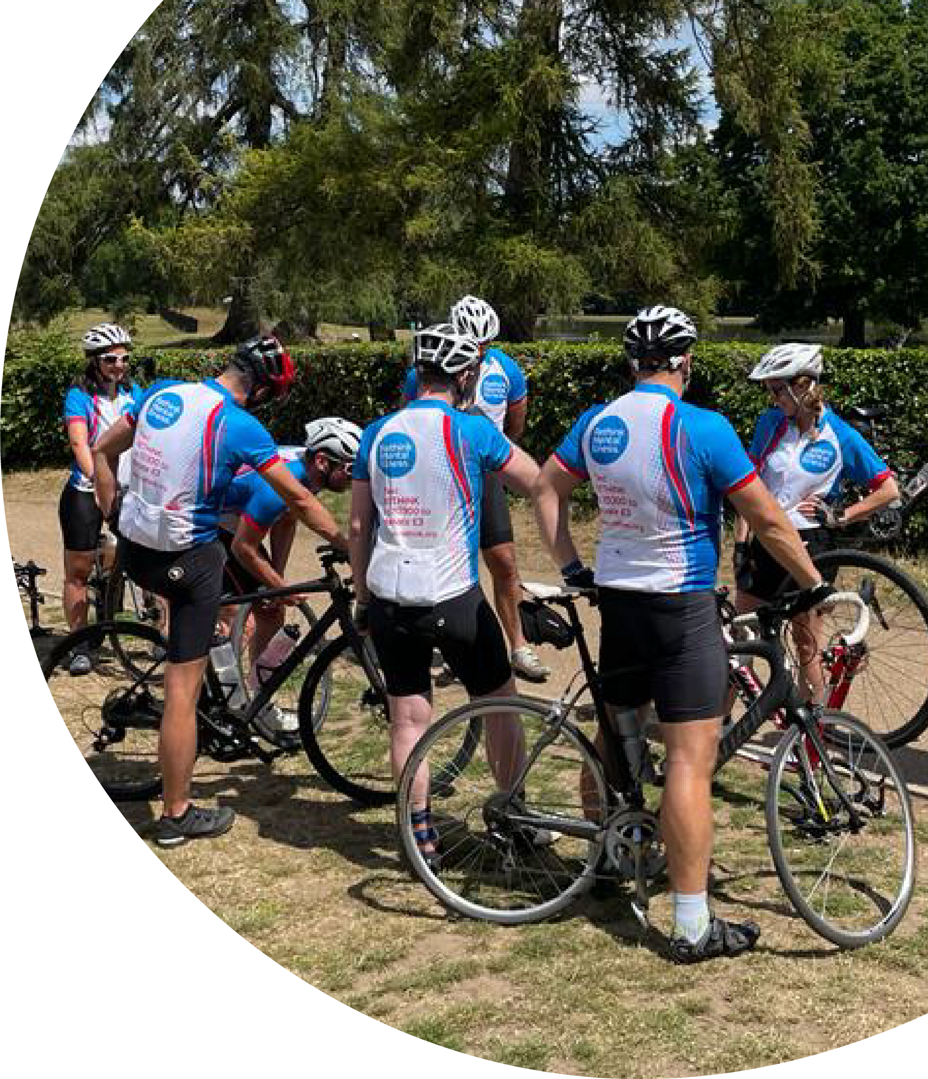 Cyclists gathering outdoors for a charity ride.