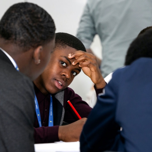 Students engaged in a discussion during a workshop.