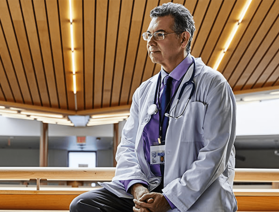 A Men sitting in the floor.