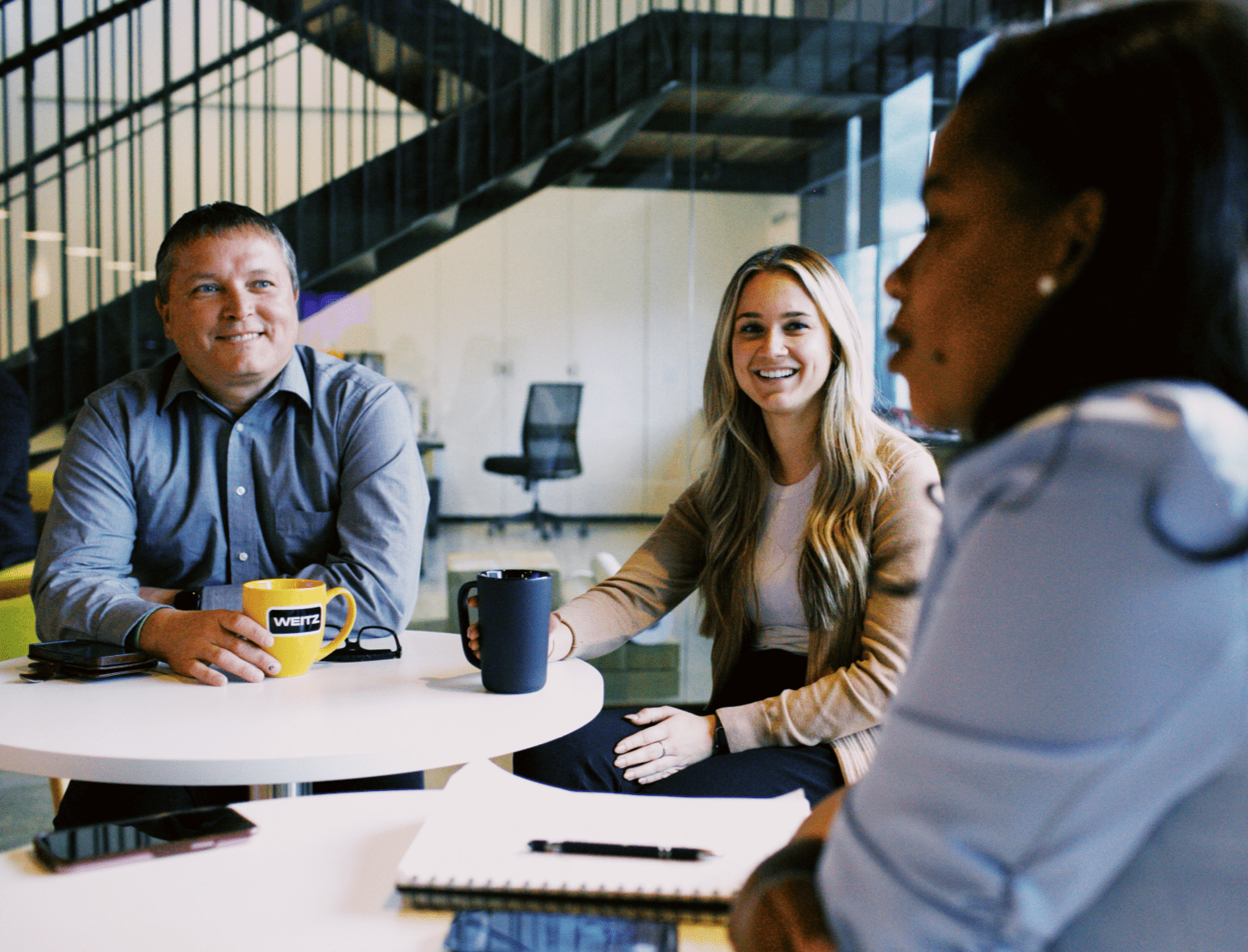 Team members collaborating in a meeting room discussion