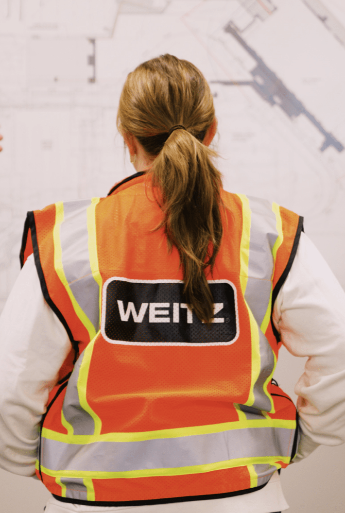 Girl sitting with Weitz safety jacket.
