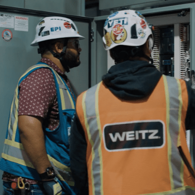 Construction workers collaborating on a project site