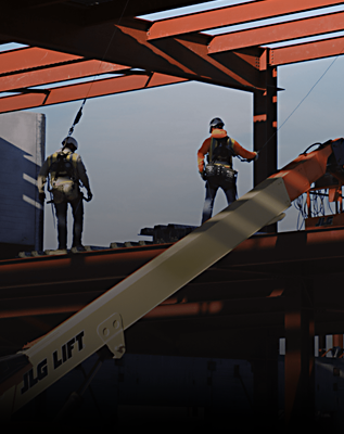 Construction worker carrying beam.