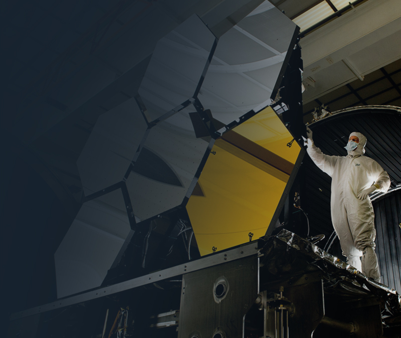 Engineer inspecting yellow and black machinery.