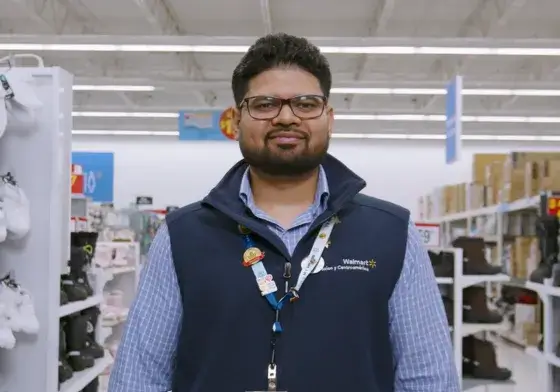 Male employee standing in a Walmart department store