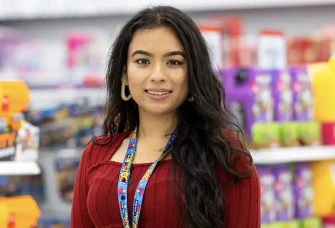 Employee standing in Walmart aisle