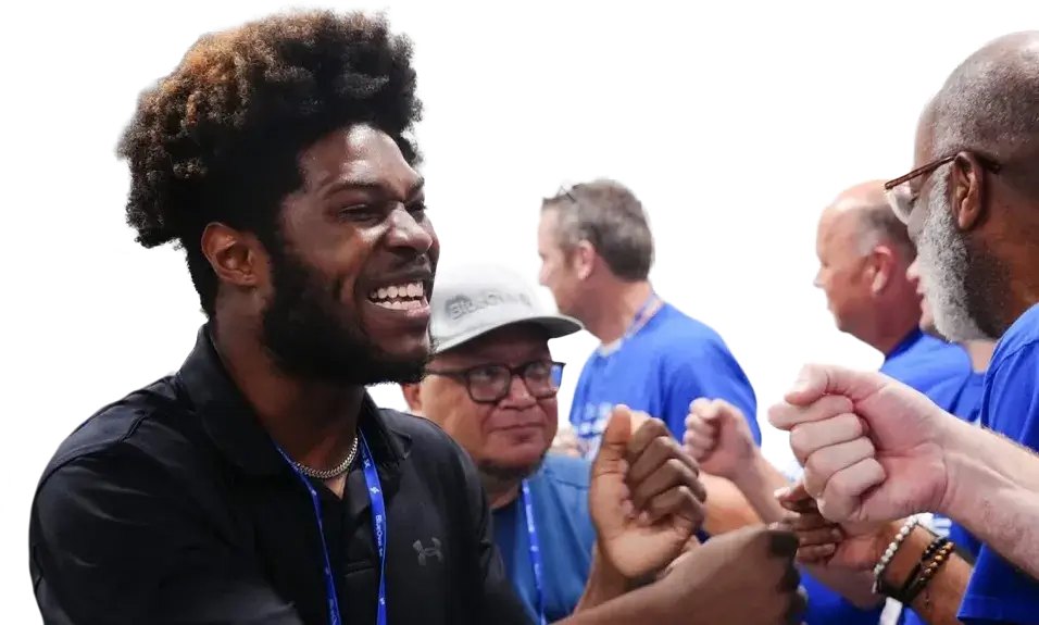 Two peoplew looking at a computer monitor