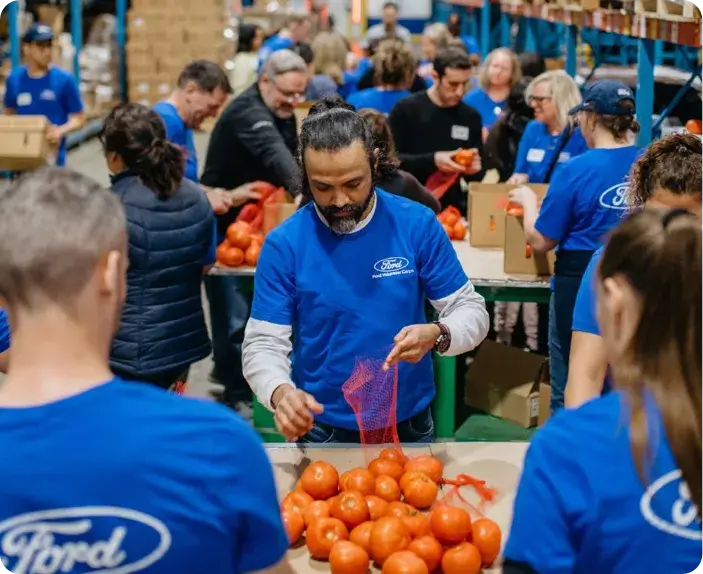 Volunteer packing oranges
