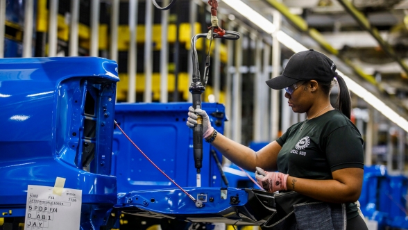 Ford hourly production employee working on the line