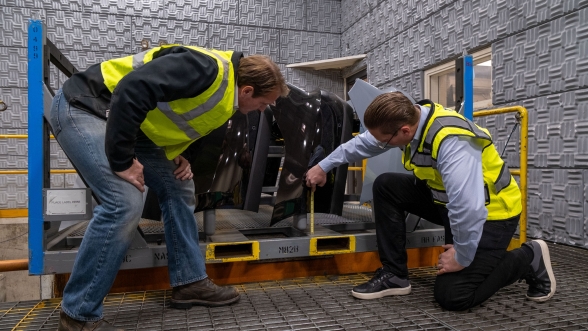 2 quality engineers at Ford inspecting a vehicle component