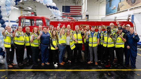 Ford plant supervisors celebrating a vehicle launch