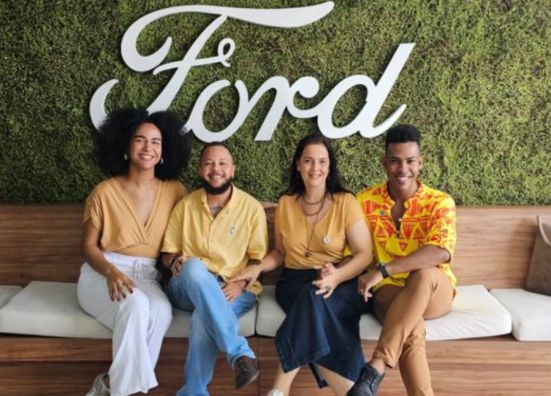 4 Ford employees in Brazil posing in the office