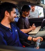 Ford employee showcasing vehicle technology to a customer in South America.