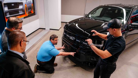 Ford employees discussing the design of the F-150 bumper