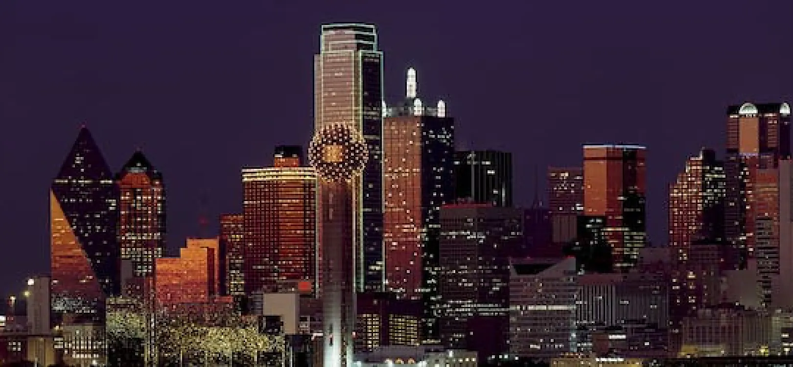 Dallas skyline at night with lit-up buildings