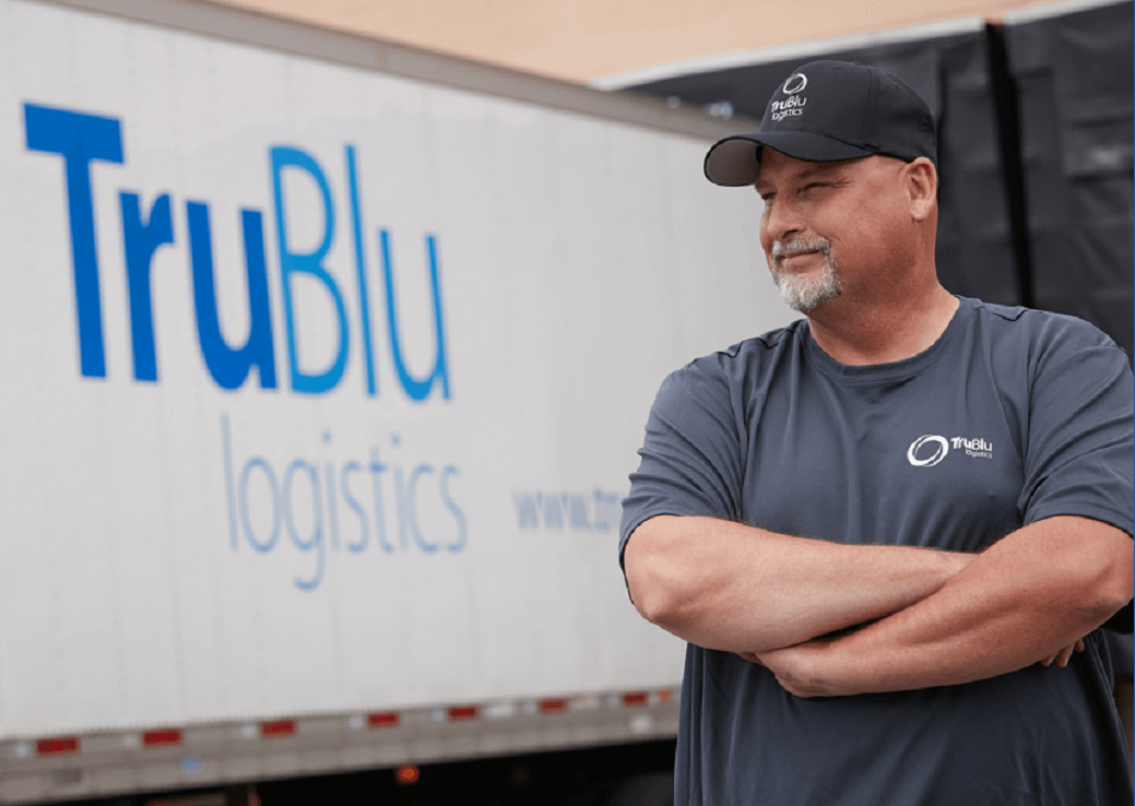 Person standing in front off a truck