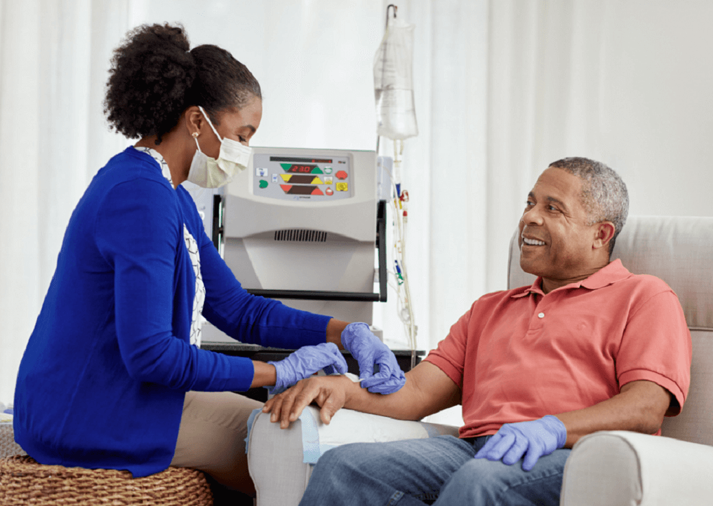 Home Therapies professional tending to a patient