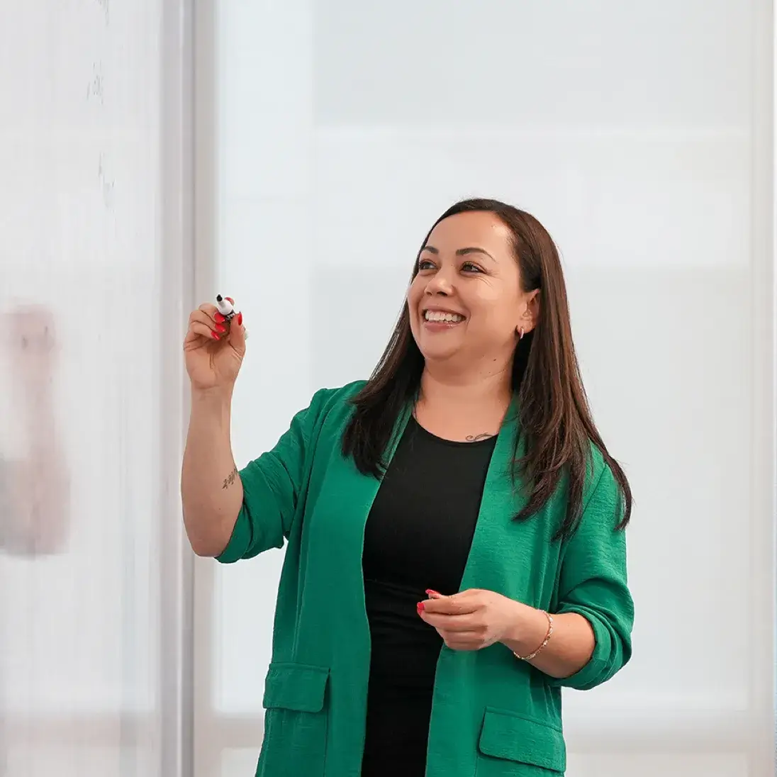 employee writing on a board