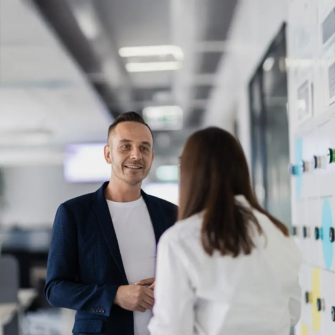 two employees conversing