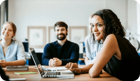Group of people sitting at a conference table