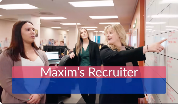 Group of Recruiters looking at a whiteboard in an office