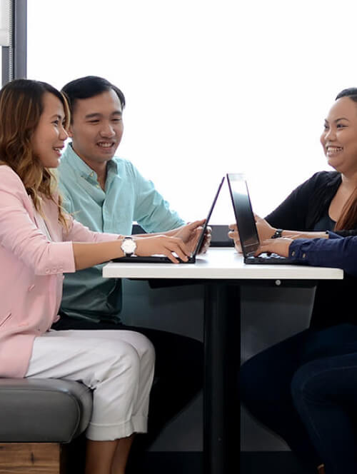 people sitting in a booth