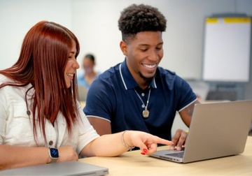 woman and man at a laptop